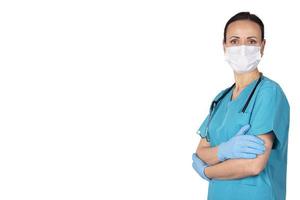 Woman doctor in medical clothes looking straight ahead. White background. Copy space. photo