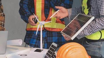 Two business man construction site engineer. Engineering objects on workplace with partners interacting on background video