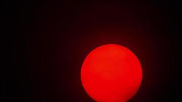 Red sun sphere in thick smog from forest fires video