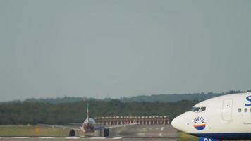 View of the runway from the end. Passenger jet aircraft picks up speed before take off video