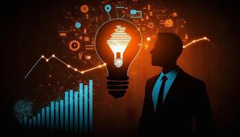 a silhouette Businessman holding creative light bulb with growth graph. photo
