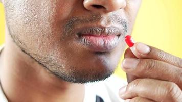 young man hand holding a medicine pill video