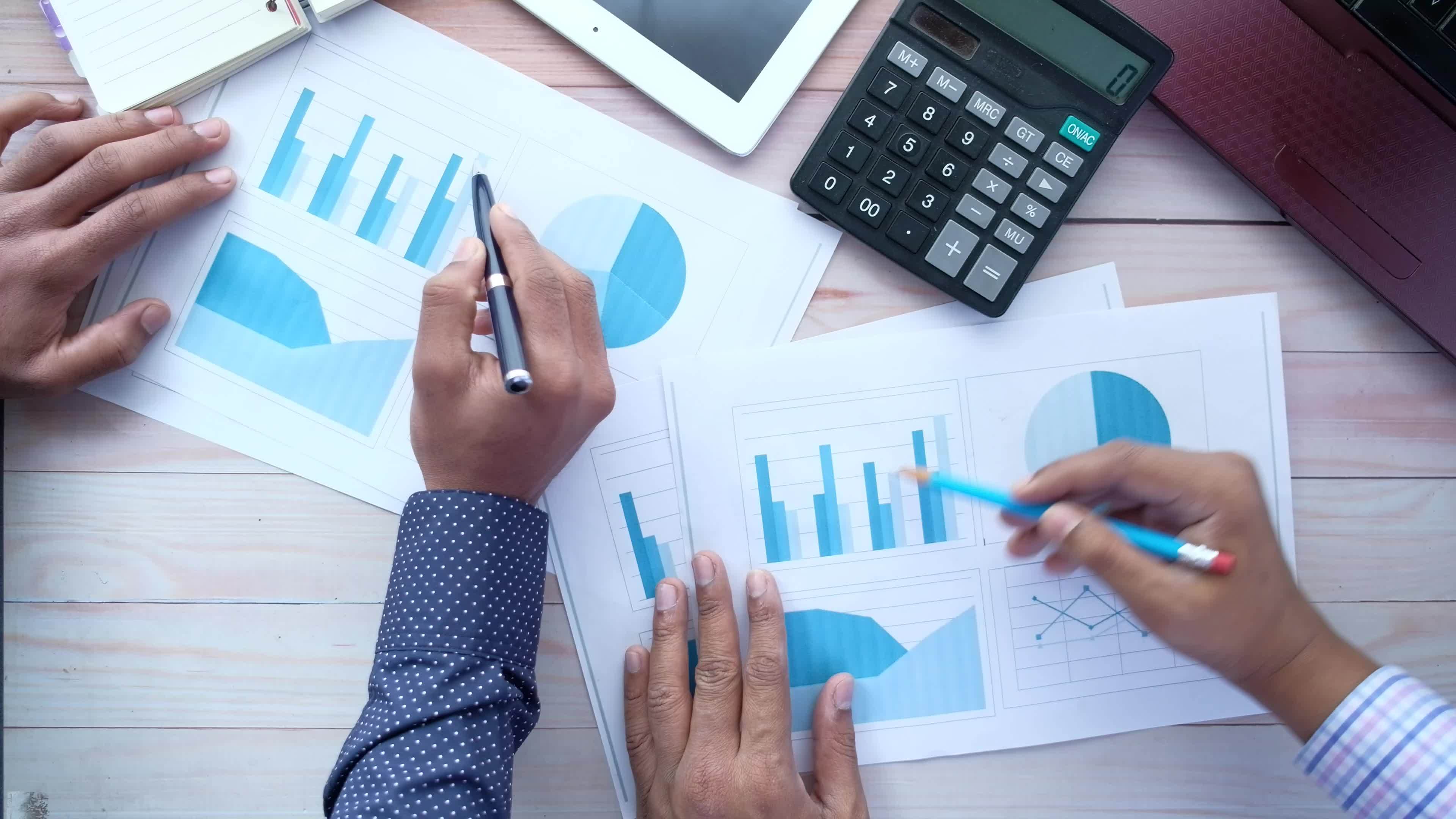 Unrecognized young people analyzing bar chart on paper 22412109 Stock