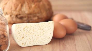 Fresh dairy products, milk, cheese, eggs, bread on table video