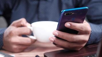 Man working from home using smart phone video