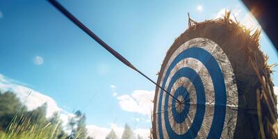 high success concept A red dart arrow aims at the target in the center of the dartboard. Target hit in the middle. . photo