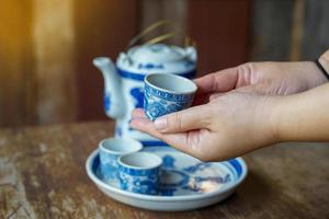 Set of bowls and teacups chinese art blue dragon painting pattern. Soft and selective focus. photo