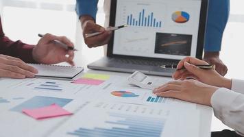 Financial analysts analyze business financial reports on a digital tablet planning investment project during a discussion at a meeting of corporate showing the results of their successful teamwork. video