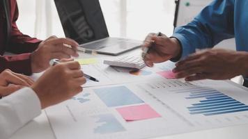 Financial analysts analyze business financial reports on a digital tablet planning investment project during a discussion at a meeting of corporate showing the results of their successful teamwork. video