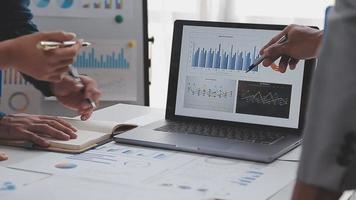 Financial analysts analyze business financial reports on a digital tablet planning investment project during a discussion at a meeting of corporate showing the results of their successful teamwork. video