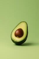 Studio shoot of half an avocado with pit on light green solid background. Ai genearated. photo