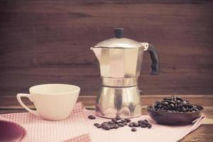 still life coffee bean and cup on wood photo