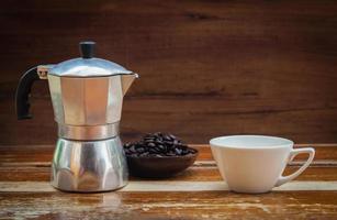 still life coffee bean and cup on wood photo