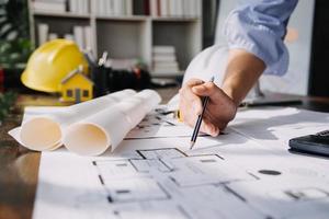 Two business man construction site engineer. Engineering objects on workplace with partners interacting on background photo