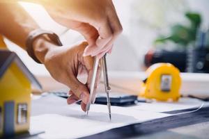 Two business man construction site engineer. Engineering objects on workplace with partners interacting on background photo