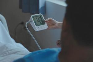 Women Asian doctors hold the patient hand and encourage and provide medical advice While checking the patient health in bed. Concept of Care and compassion, antenatal care, Threatened abortion photo