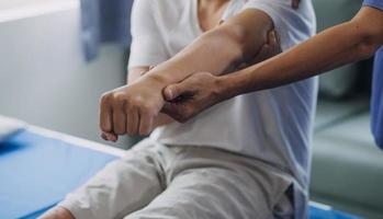 Patient doing some special exercises under supervision in a room photo