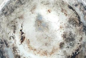 grunge and dirty metal texture from the bottom of old cooking pot photo