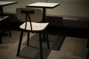 Table and chair. Interior with furniture. White small table. photo