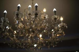 Chandelier with lamps. Light in interior. Antique glass chandelier. photo