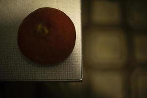 Dry fruit on table. Little pumpkin. Dry plant. photo