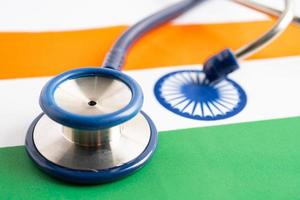 Stethoscope on India flag background, Business and finance concept. photo