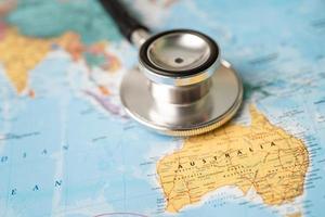 Bangkok, Thailand June 1, 2022, Stethoscope on Australia world globe map background. photo