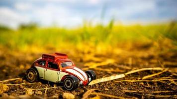 South Minahasa, Indonesia  February 2023, toy car on green grass photo