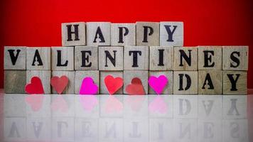 Happy valentine day on wooden blocks photo