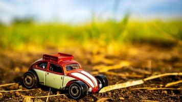 South Minahasa, Indonesia  February 2023, toy car on green grass photo