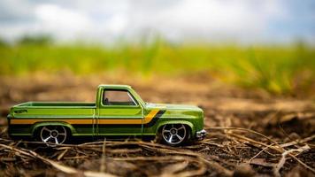 South Minahasa, Indonesia  February 2023, toy car on green grass photo