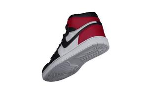 A high sneaker with red and black accents. Athletic boot. photo