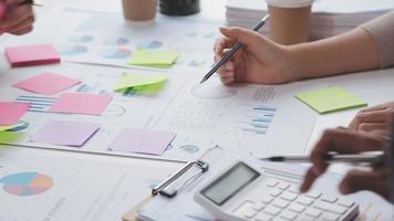 Financial analysts analyze business financial reports on a digital tablet planning investment project during a discussion at a meeting of corporate showing the results of their successful teamwork. video
