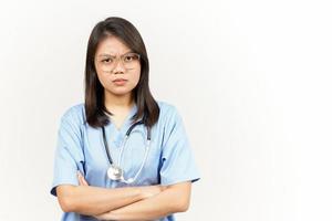 Angry Gesture Of Asian Young Doctor Isolated On White Background photo