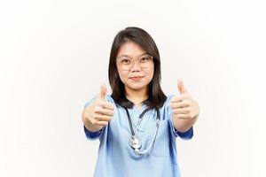 Showing Thumbs Up Of Asian Young Doctor Isolated On White Background photo