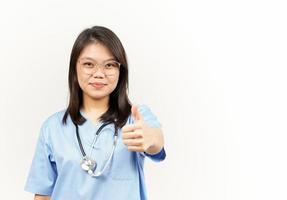 Showing Thumbs Up Of Asian Young Doctor Isolated On White Background photo