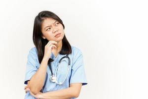 Thinking and Curious Of Asian Young Doctor Isolated On White Background photo