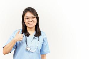 Showing Thumbs Up Of Asian Young Doctor Isolated On White Background photo