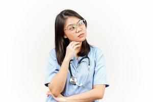 Thinking and Curious Of Asian Young Doctor Isolated On White Background photo