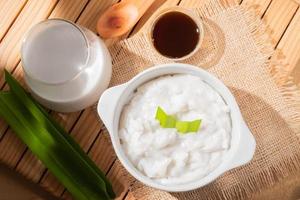 Porridge in a serving bowl. Marrow porridge is a kind of food in the form of white porridge made from rice flour. Authentic Indonesian food photo