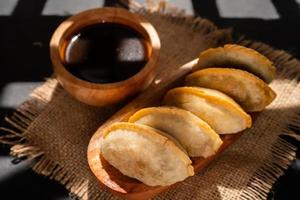 Cireng with chicken filling in a wooden bowl. Cireng is a traditional West Javanese food made from tapioca flour photo