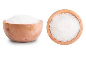White sugar in wooden bowl isolated on white background with clipping path photo