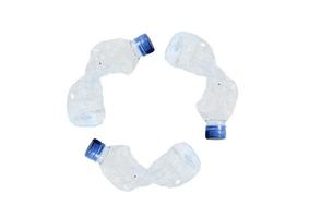 Crumpled plastic bottles forming a recycle sign. The concept of using plastic. Attractive ecological problem positive poster. photo