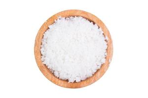 Sea salt in a bowl on a white background, sea salt is the salt produced by the evaporation of seawater. photo