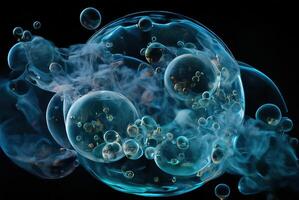 Blue smoke in water drops on a black isolated background. photo