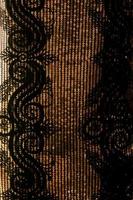 Close-up of abstract sequins or beaded clothes decoration. photo