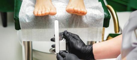 Nail file tool in hands photo