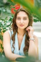 Woman sitting in flower garden photo