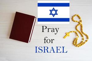 Pray for Israel. Rosary and Holy Bible background. photo