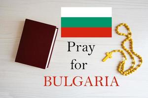 Pray for Bulgaria. Rosary and Holy Bible background. photo